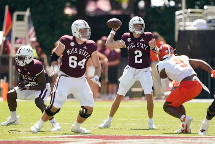 Mississippi State quarterback Will Rogers (2) sets up to pass while Bowling Green linebacker Blaine Spires (9) attempts to pressure him during the first half of an NCAA college football game in Starkville, Miss., Saturday, Sept. 24, 2022. Mississippi State won 45-14. (AP Photo/Rogelio V. Solis)